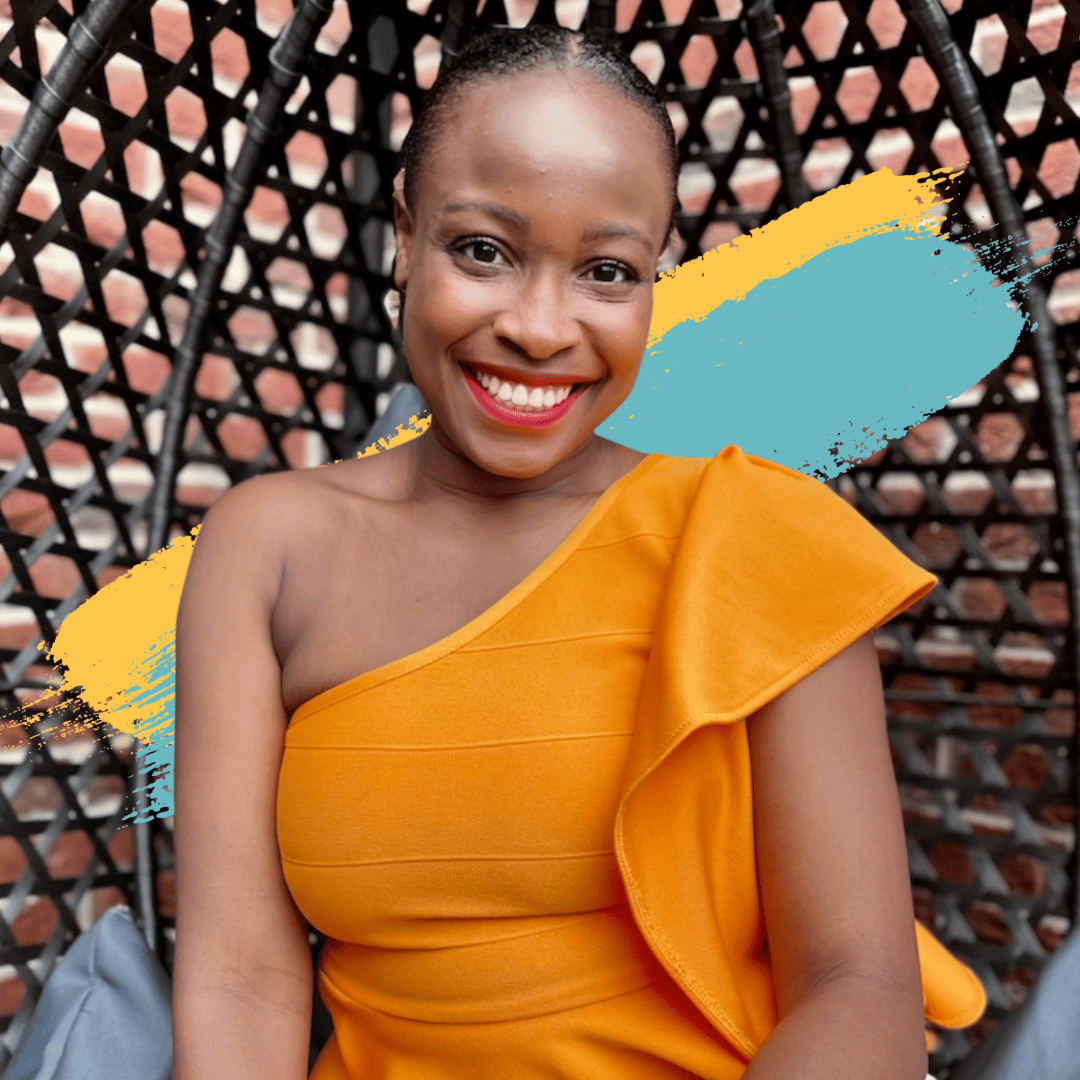 Picture of Sophia Ukor. Sophia is a black woman with dark brown hair which is tied into a bun. She is sitting down while smiling at the camera. She is wearing a bright orange one shoulder short sleeved blouse with a loose frill shoulder detail. There are blue and yellow graphic strokes in the background.